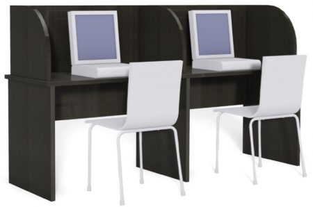 Two computer stations for a single person to use. The computer stations are separated by a privacy wall.